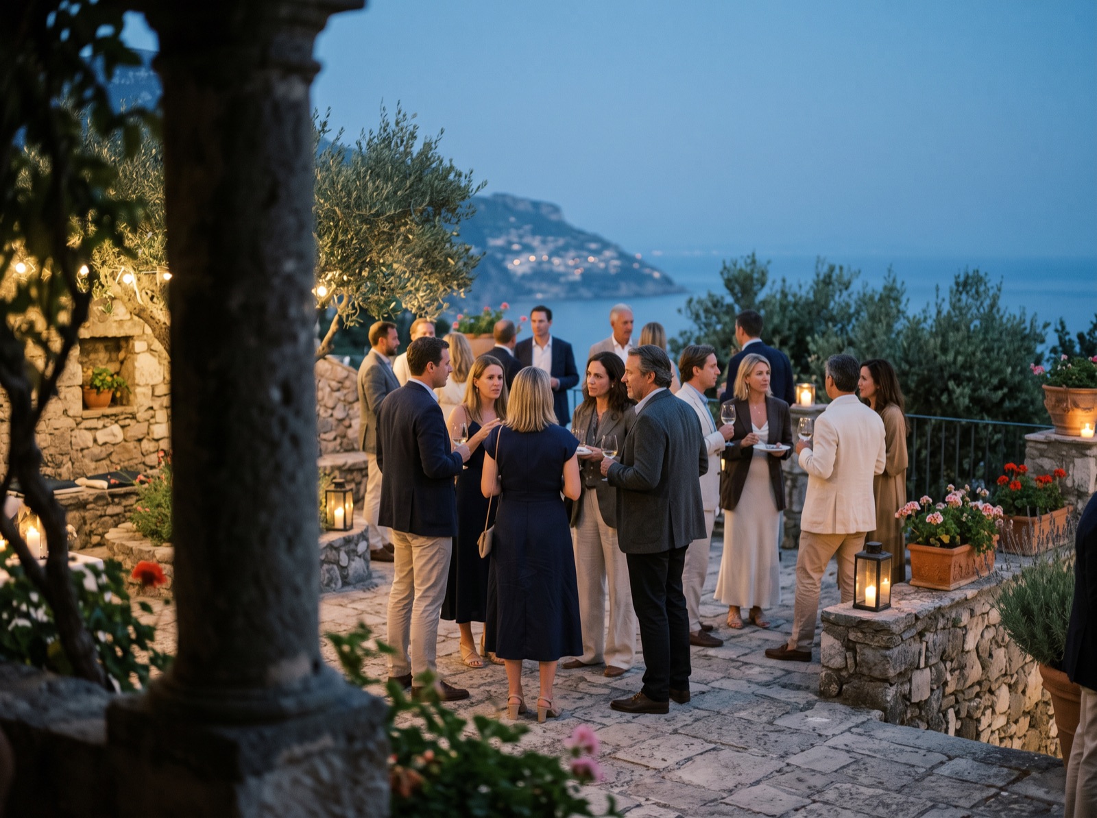Guests at an evening reception on a stone terrace