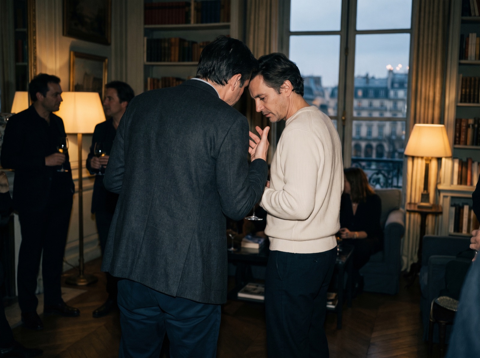 Two guests in conversation at a private reception